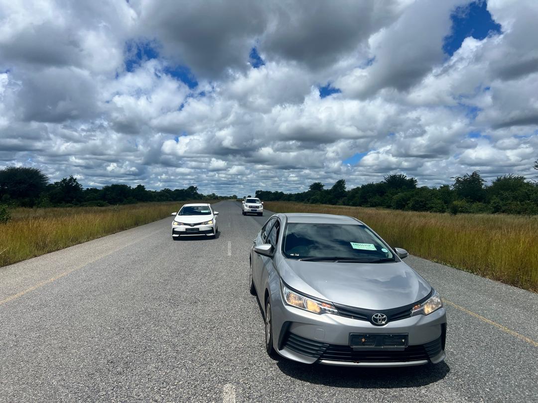Convoy of vehicles in transit on the open road